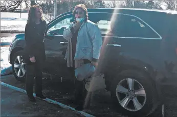  ?? PORTER COUNTY AGING AND COMMUNITY ?? Kathy Conn is surprised with a donated car from NeighborLi­nk Porter County Executive Director Judy Alders.