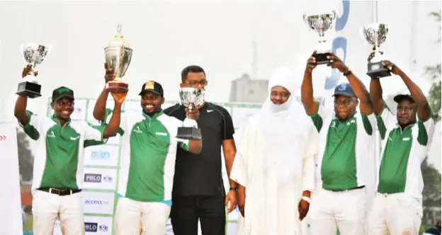  ?? Four time champions of Port Harcourt Internatio­nal Polo Tournament, Abuja Rubicon players show off their prizes after presentati­on by the representa­tive of the Lamido Adamawa, HRH Alhaji (Dr.) Muhammadu Barkindo Aliyu Musdafa in the Garden City last weeke ??