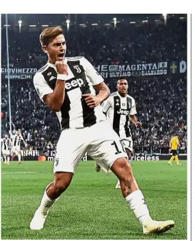  ?? — AFP ?? Right on target: Juventus forward Paulo Dybala celebratin­g after scoring the opening goal against Young Boys during the Champions League Group H match at the Juventus Stadium on Tuesday.