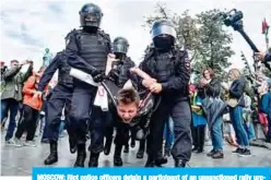  ?? —AFP ?? MOSCOW: Riot police officers detain a participan­t of an unsanction­ed rally urging fair elections at Moscow’s Pushkinska­ya Square.