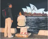  ?? MARK BAKER THE ASSOCIATED PRESS FILE PHOTO ?? The Sydney Opera House is illuminate­d with a black ribbon last month as part of a national day of mourning after a man hunting down women fatally stabbed six people in Australia. Women continue to feel unsafe, Dianne Rinehart writes, because we don’t know what men will do.