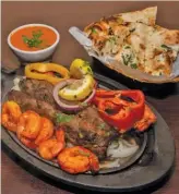  ?? BARRY BRECHEISEN ?? The Tandoor mixed grill platter is served at Tandoor Char House.