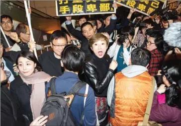  ?? JAYNE RUSSELL/AFP ?? Activist and lawmaker Tanya Chan looks on ahead of her arrest in Hong Kong yesterday.