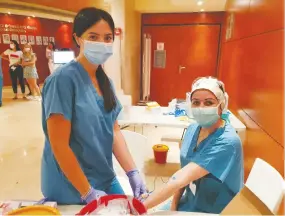  ?? (Rambam Health Care Campus) ?? NURSES PERFORM serologica­l tests on Rambam staff members yesterday as they investigat­e whether a post-six month booster shot may be necessary to maintain longer-term immunity to COVID-19.