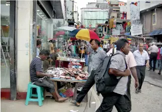  ??  ?? Pavement hawkers in Pettah. Pic by Athula Devapriya.