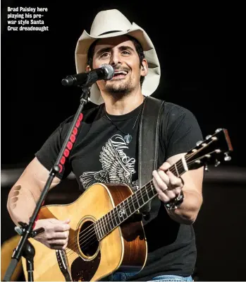  ?? ?? Brad Paisley here playing his prewar style Santa Cruz dreadnough­t