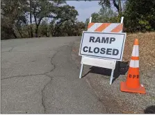  ?? ?? A sign at the entrance of the Loafer Creek Campground letting users know the Loafer Point Launch Ramp is closed Tuesday in Palermo.