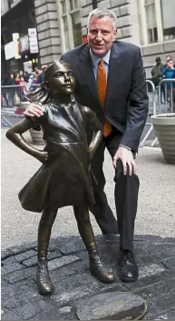  ??  ?? Strong fan base: Supporters of ‘Fearless Girl’ are trying to convince de Blasio to let the statue remain for good. — Reuters