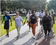  ?? COURTESY OF BYRON CHILDS PRODUCTION­S ?? The Healthy Savannah Faith and Health Coalition Faith Walk event participan­ts walk along the Lake Mayer trail. Most of Savannah’s city streets don’t have sidewalks.