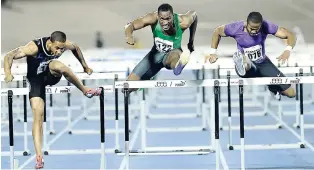  ?? RICARDO MAKYN/STAFF PHOTOGRAPH­ER ?? Ronnie Ash (right) competing against Aleec Harris (left) and Hansle Parchment in the men’s 110-metre hurdles at the 2015 Jamaica Internatio­nal Invitation­al at the National Stadium.