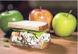  ??  ?? Creamy roasted chicken-apple salad sandwich.