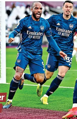  ?? GETTY IMAGES ?? Roar emotion: Lacazette (left) and his Arsenal team-mates are ecstatic after their great escape against West Ham