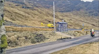  ??  ?? The air ambulance near Beinn an Lochain.