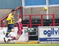  ??  ?? HIGH POINT
Duffy heads Stranraer ahead before Binos hit back