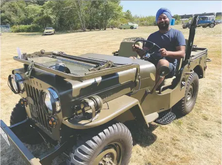  ?? PHOTOS: ALYN EDWARDS/DRIVING ?? Sukh Riar shows off the 1953 Willys CJ3B Jeep that he restored in his home garage.