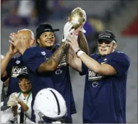  ?? ROSS D. FRANKLIN — THE ASSOCIATED PRESS ?? Offensive player of the game, Penn State quarterbac­k Trace McSorley, right, and defensive player of the game, Saturday in Glendale, Ariz. Penn State won 35-28.