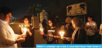  ?? — Photo by Yasser Al-Zayyat ?? KUWAIT: A candleligh­t vigil is held at Jamal Abdul Nasser Public Garden in Rawda yesterday.