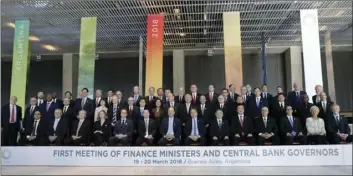  ??  ?? Finance ministers and central bank governors pose for a picture during the G20 finance ministers and central bankers summit in Buenos Aires, Argentina, on Monday. Finance ministers and central bankers of G20 countries are meeting in Argentina at a...