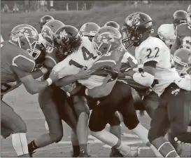  ?? Kevin Myrick / Standard Journal ?? The Armuchee defense struggles to push back against QB Dylan Bailey.