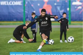  ??  ?? NIZHNY NOVGOROD: Uruguay’s forward Luis Suarez controls the ball as he takes part in a training session ahead of the Russia 2018 World Cup at the Sport Centre Borsky, in Nizhny Novgorod yesterday. — AFP