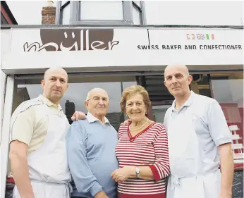  ??  ?? Gianna Müller in 2010 with husband Max, sons Max, left, and Bruno outside their Villette Road shop.