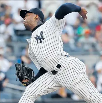  ?? Elsa Garrison Getty Images ?? THE STEEP PRICE PAID by the Chicago Cubs to pry closer Aroldis Chapman, above, from the New York Yankees: four players, including an elite prospect, 19-year-old shortstop Gleyber Torres.