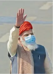  ??  ?? Prime Minister Narendra Modi waves to the public at Rajpath, during the 72nd Republic Day celebratio­ns in New Delhi on Tuesday. — PTI