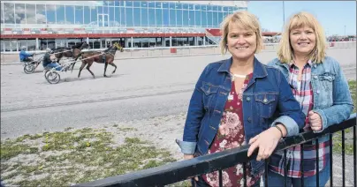  ?? JASON MALLOY/THE GUARDIAN ?? Sisters Francie, left, and Lori Hennessey look forward to the Gold Cup & Saucer each year. They both work at The Guardian and were excited to learn the news outlet will be the title sponsor of the big race for the next three years.