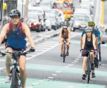  ?? Photo / Michael Craig ?? An Auckland Transport survey shows 65 per cent of Aucklander­s are in favour of cycle lanes.
