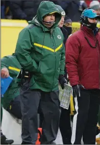  ?? AP/JEFFREY PHELPS ?? Green Bay Coach Mike McCarthy (center) was fired after the Packers’ 20-17 loss to the Arizona Cardinals on Sunday. The loss dropped the Packers’ record to 4-7-1.