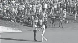  ?? MICHAEL CHOW/THE REPUBLIC ?? Webb Simpson, left, shakes hands with Tony Finau after winning the Waste Management Phoenix Open in a playoff on Feb. 2.