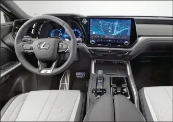  ?? ?? The TX’S dashboard has a 7-inch or available 12.3-inch digital cluster for the driver and a 14-inch infotainme­nt display with built-in navigation plus Apple Carplay and Android Auto connectivi­ty.