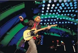  ?? Luis Sinco Los Angeles Times ?? TOM PETTY leads the Heartbreak­ers and the L.A.-founded band’s home crowd through 40 years’ worth of singalong rock ’n’ roll classics at the Hollywood Bowl.