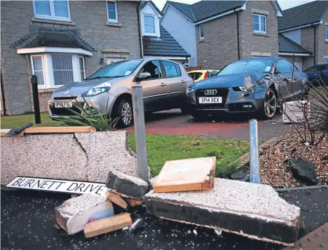  ??  ?? The wall outside Kevin Stead’s home was left badly damaged, as was an Audi in his driveway.