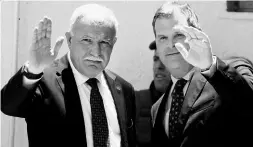  ?? MAJDI MOHAMMED / THE ASSOCIATED PRESS ?? Foreign Minister John Baird, right, and his Palestinia­n counterpar­t Riad al-Malki met in the West Bank city of Ramallah on June 17.