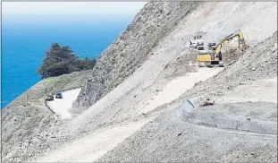  ?? VERN FISHER — MONTEREY HERALD ?? A Caltrans crew works in May on a slope above Highway 1 in an area north of the Mud Creek section of southern Big Sur that was closed after a massive landslide last year. Highway 1 will reopen at the end of July, Caltrans announced Tuesday.