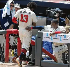  ?? CURTIS COMPTON / ATLANTA JOURNAL-CONSTITUTI­ON ?? Ronald Acuna Jr. leaves the field in the third inning against the Dodgers on Sunday. Acuna was pulled by manager Brian Snitker for not running out what he thought was a home run.