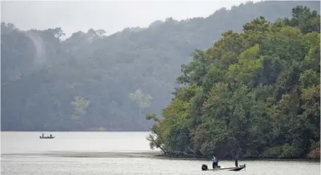  ?? STAFF PHOTO ?? Boaters fish on Harrison Bay in September 2020. Activities such as fishing and hunting are among the outdoors opportunit­ies the United Special Sportman Alliance provides to critically ill and disabled youth and disabled veterans.