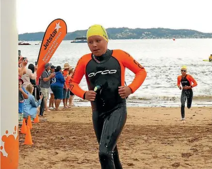  ?? SUPPLIED ?? Alex Dunkley, 11, crosses the finish line - securing his spot on an elite national swim squad.