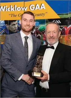  ??  ?? County hurler of the year John Henderson from Bray Emmets collects his award from former GAA President Sean Kelly and Wicklow County
