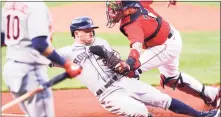  ?? Getty Images ?? Alex Bregman of the Houston Astros is tagged out at the plate by Christian Vazquez of the Boston Red Sox earlier this year.