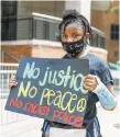  ?? ALYSSA POINTER/AP ?? T'Kaia Veney poses for a photo as she attends a rally outside of the Atlanta City Detention Center on Sunday. Rayshard Brooks died during a confrontat­ion with police officers at a fast food restaurant in Atlanta on Friday.