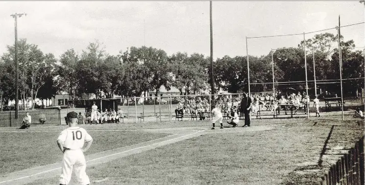  ?? THE ASSOCIATED PRESS ?? A 1955 Little League Baseball game between the Pensacola Jaycees and the Orlando Kiwanis is pictured in Lake Lorna Doone Park in Orlando, Fla. The new documentar­y Long Time Coming: A 1955 Baseball Story has brought this snippet of the American experience back to life.