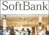  ??  ?? In this Dec. 4, 2018, file photo, people walk past in front of a SoftBanksh­op at Ginza shopping district in Tokyo. SoftBankGr­oup Corp. says the price for the initial public offering of its Japanese mobile subsidiary has been set at 1,500 yen($13) a share. (AP)