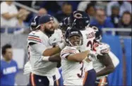  ?? PAUL SANCYA - THE ASSOCIATED PRESS ?? Chicago Bears quarterbac­k Chase Daniel, left, congratula­tes free safety Eddie Jackson (39) after Jackson returned an intercepti­on 41-yards for a touchdown during the second half of an NFL football game against the Detroit Lions, Thursday, Nov. 22, 2018, in Detroit.