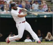  ??  ?? The Indians’ Mike Napoli hits an RBI single off Los Angeles Angels starting pitcher Jered Weaver during the fifth inning of a game Aug. 14.