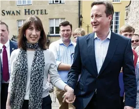  ??  ?? SamCampaig­n: Cameron hand in hand with his wife in Wells yesterday