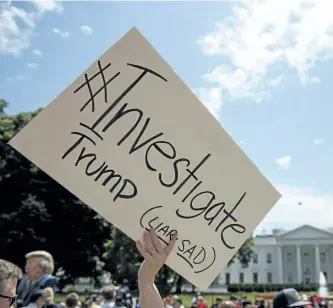  ?? EVAN VUCCI/AP PHOTO ?? Demonstrat­ors gather outside the White House a day after U.S. President Donald Trump fired FBI Director James Comey, Wednesday in Washington.