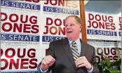  ??  ?? Doug Jones speaks during a campaign rally Sunday in Birmingham, Ala.