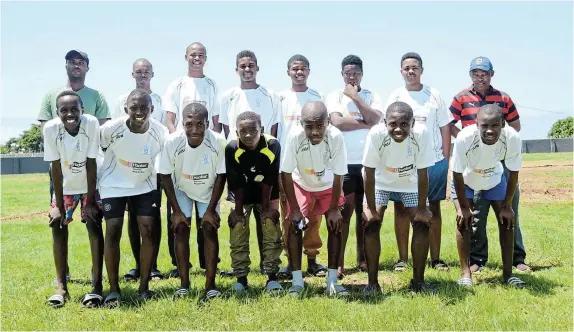  ?? Picture: MARK CARRELS ?? JERSEY JOY: Young Pirates’ players and their coaches show off their new kit at a gathering at their Walter Matthews home ground in Nemato township on Friday last week. In the background are left, coach Xolani Bukani and Dave Mabona.